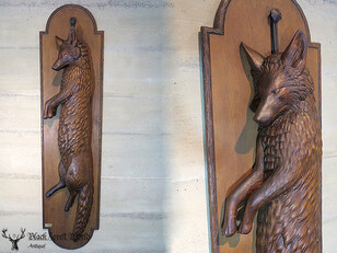 Black forest carved fox game plaque